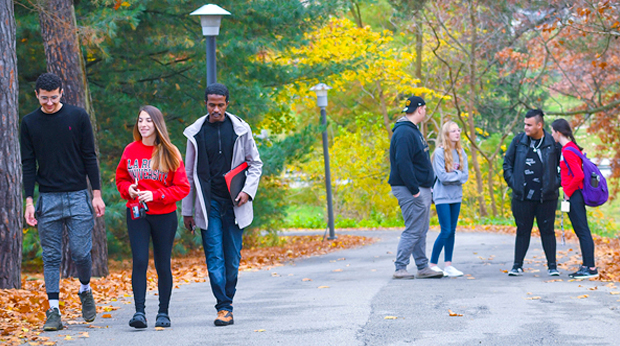 A group of La Roche University students walk on campus in the Fall